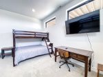 3rd bedroom with 2 Twin over Queen bunk beds and desk and TV